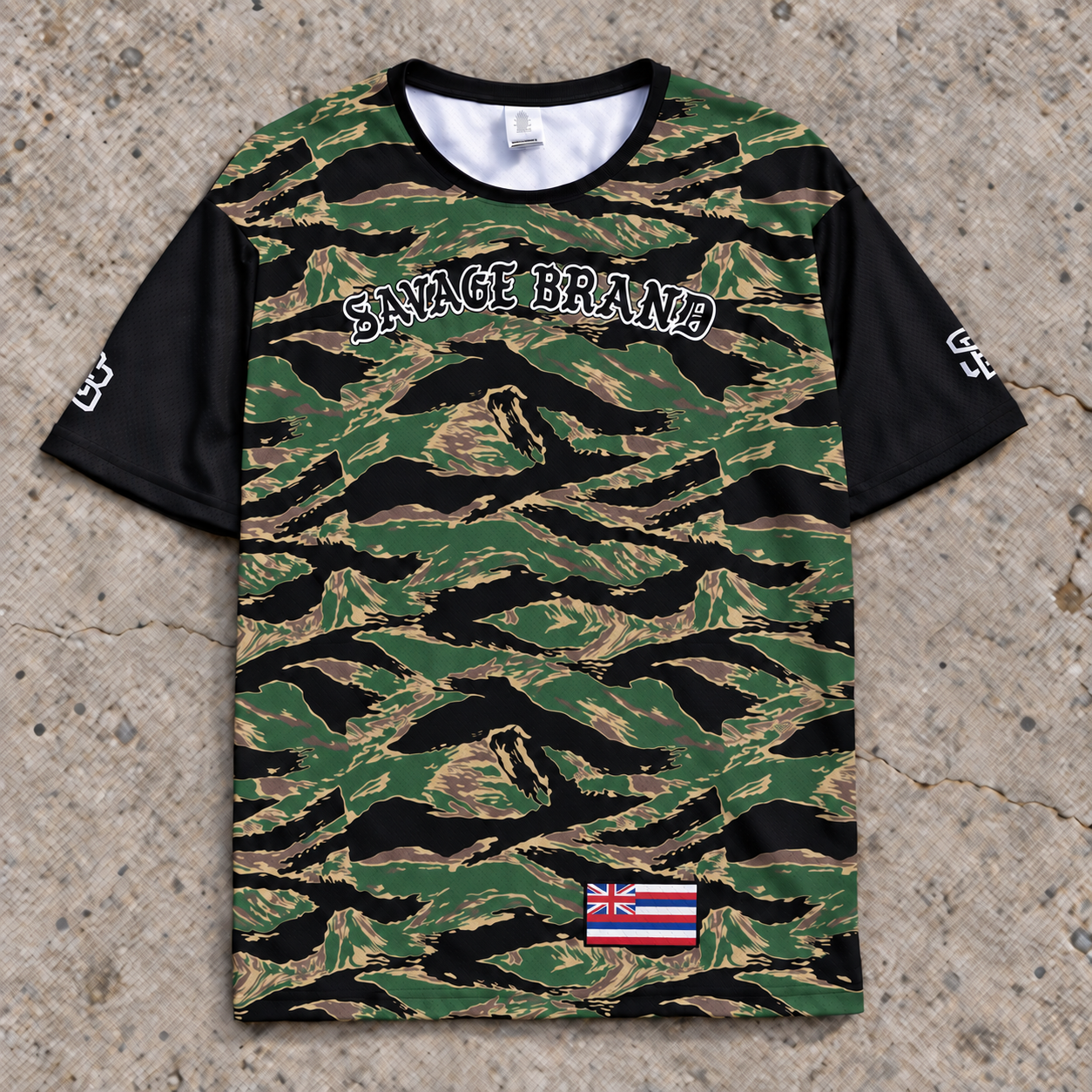 Front of the Lahaina 61 short-sleeve jersey in tiger camo, with Savage Brand across the chest and black sleeves.